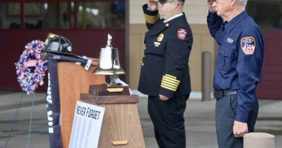 Michael S. Lockett / The Daily World
Chief Brian Ritter and Assistant Chief Mike Mandella of Ocean Shores Fire Department salute during a 9/11 ceremony.