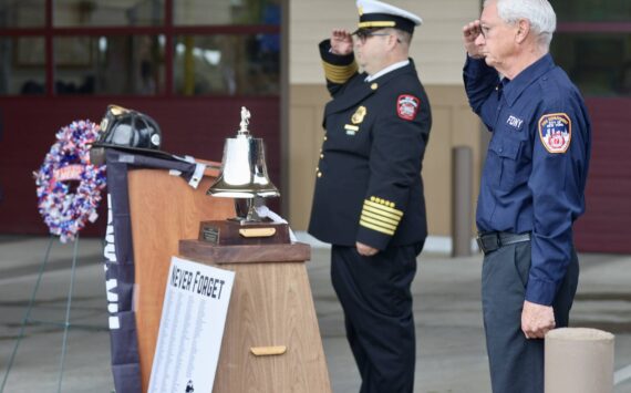 Michael S. Lockett / The Daily World
Chief Brian Ritter and Assistant Chief Mike Mandella of Ocean Shores Fire Department salute during a 9/11 ceremony.