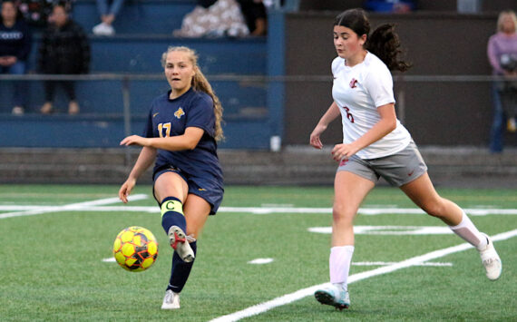 RYAN SPARKS | THE DAILY WORLD Aberdeen senior midfielder Scotlyn Lecomte (17) passes the ball while Hoquiam’s Iza Frye defends during the Bobcats’ 5-1 victory on Thursday at Stewart Field in Aberdeen.