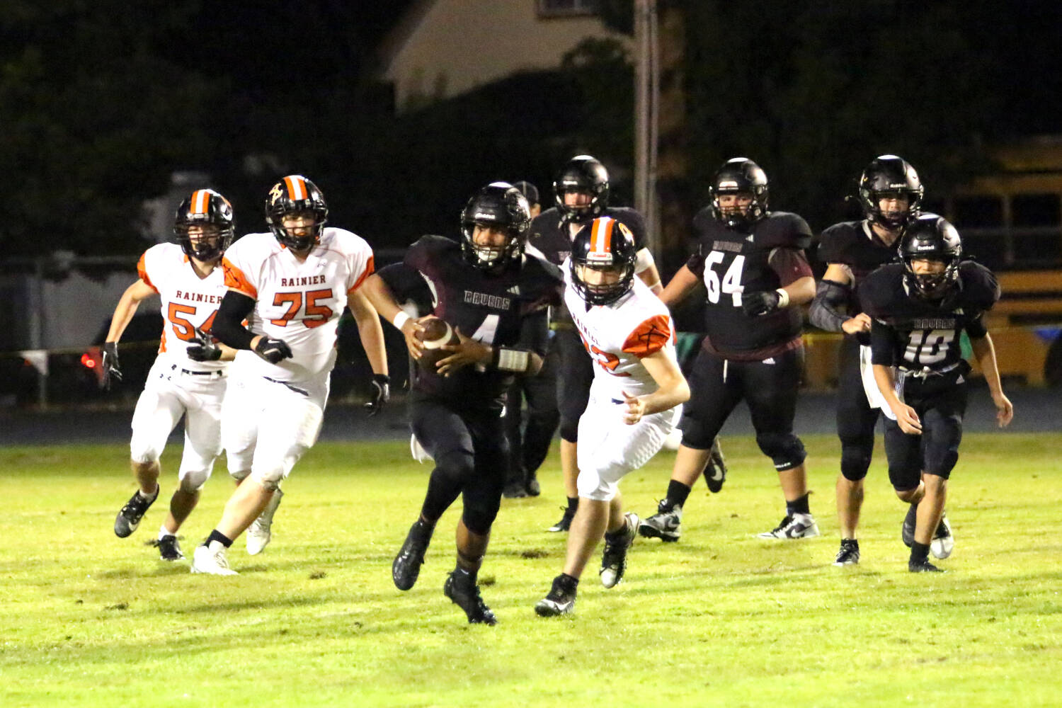 RYAN SPARKS | THE DAILY WORLD Raymond-South Bend quarterback Chris Quintana (4) breaks loose for a long run during the Ravens’ 43-34 loss to Rainier on Friday in Raymond.