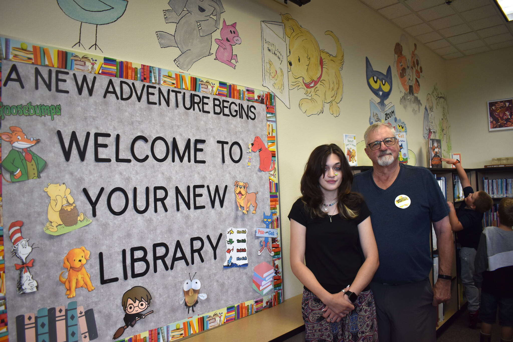 Matthew N. Wells / The Daily World
Ezri Carroll and her grandfather, Richard “Rocky” Carroll, pose for a photo in front of much of Ezri’s hard work inside McDermoth Elementary School. She spent many hours this summer in order to complete her Aberdeen High School senior project.