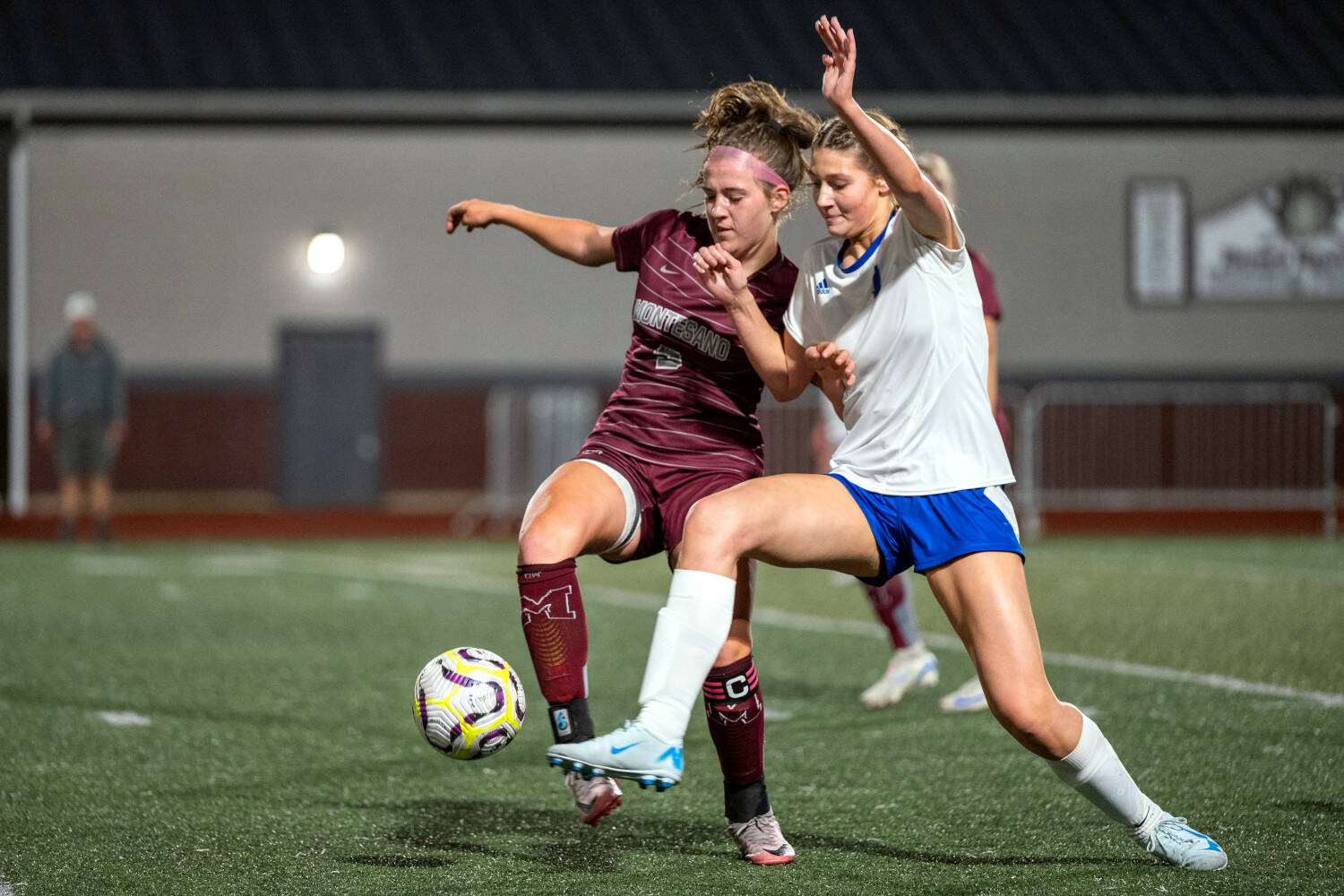 PHOTO BY FOREST WORGUM Montesano midfielder Sam Roundtree (5) and Bellevue Christian’s Lili Meissner compete for the ball during the Bulldogs’ 1-0 loss on Monday in Montesano.