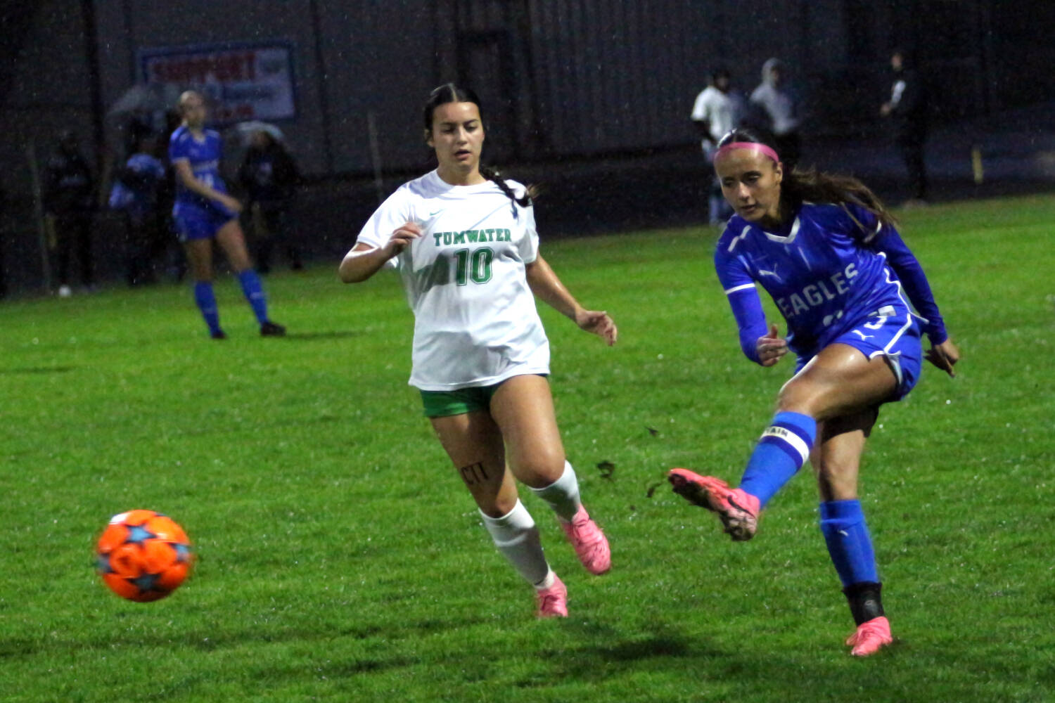 RYAN SPARKS | THE DAILY WORLD Elma senior Mia Monroe (right) moves the ball forward against Tumwater’s Esther Vuong during the Eagles’ 11-1 loss on Tuesday at Davis Field in Elma.