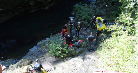 Firefighters work to recover the body of a 73-year-old man found in the Wynoochee River on Monday. (Courtesy photo / Grays Harbor County Coroner’s Office)