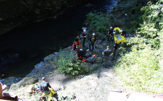 Firefighters work to recover the body of a 73-year-old man found in the Wynoochee River on Monday. (Courtesy photo / Grays Harbor County Coroner’s Office)