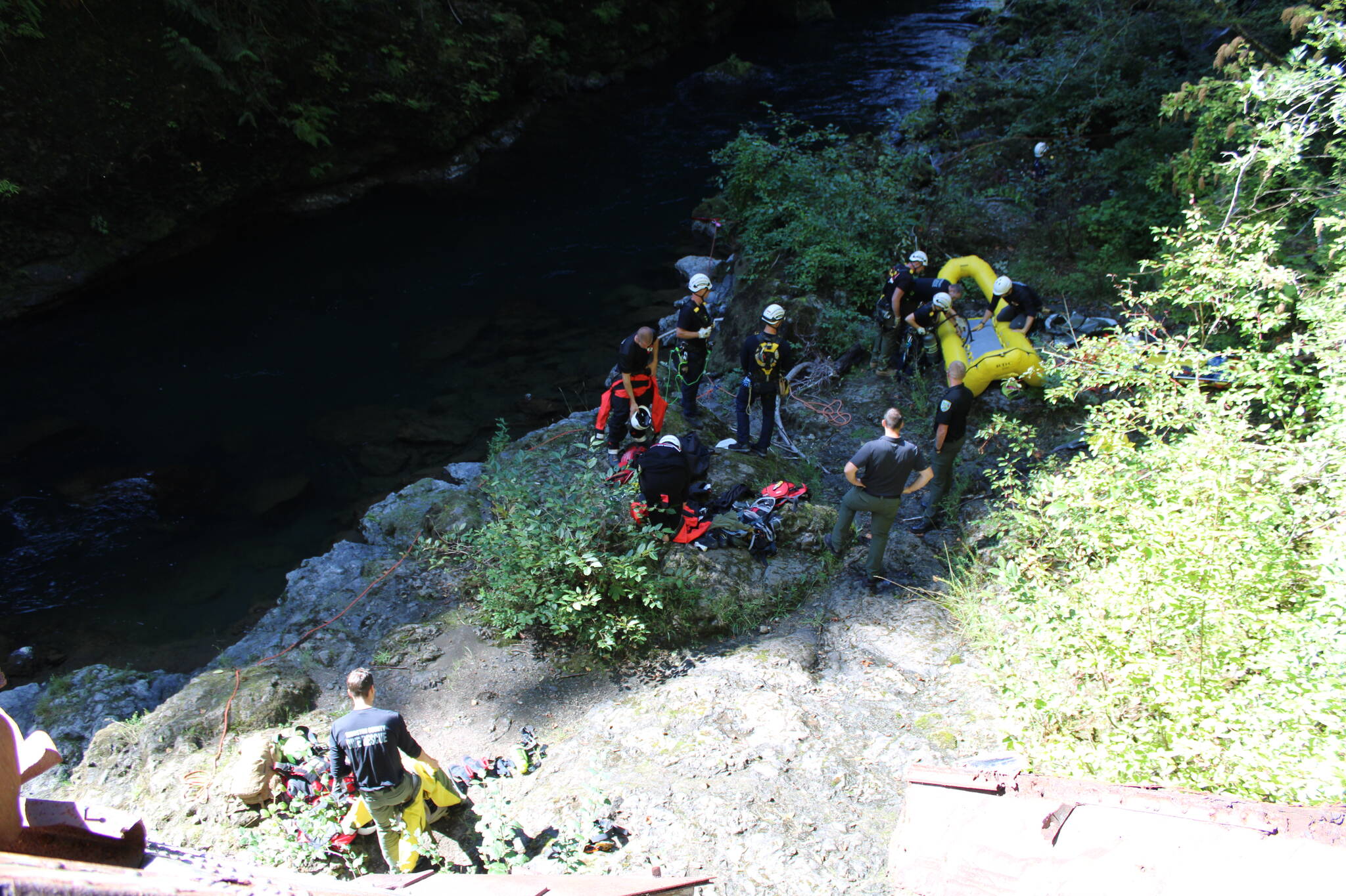 Firefighters work to recover the body of a 73-year-old man found in the Wynoochee River on Monday. (Courtesy photo / Grays Harbor County Coroner’s Office)