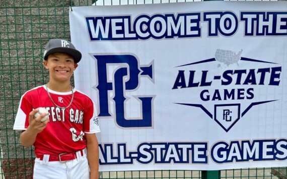 Brittany Mondor
Gunner Mondor, an 11-year-old from Ocean Shores, holds up the home run ball he hit at the Perfect Game All State Games last month.