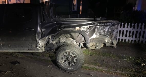 Damage from a crash involving a former mayor of Aberdeen is apparent on a parked car. (Courtesy photo / Josh Conway)