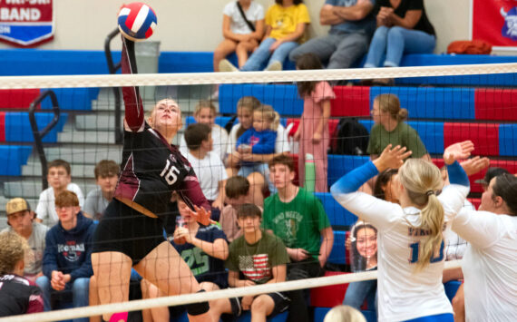 PHOTO BY VAN ADAM DAVIS Ocosta middle blocker Anna Davis (left) rises for a kill during a five-set victory over Willapa Valley on Tuesday in Menlo.