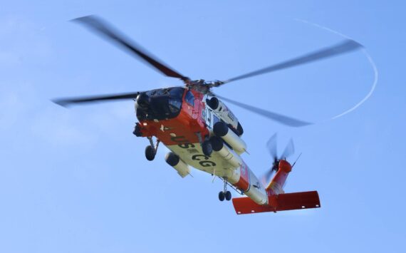 Michael S. Lockett / The Daily World
A Coast Guard aircrew rescued humans and dogs from a grounded fishing vessel in the Willipa Bay Wednesday.