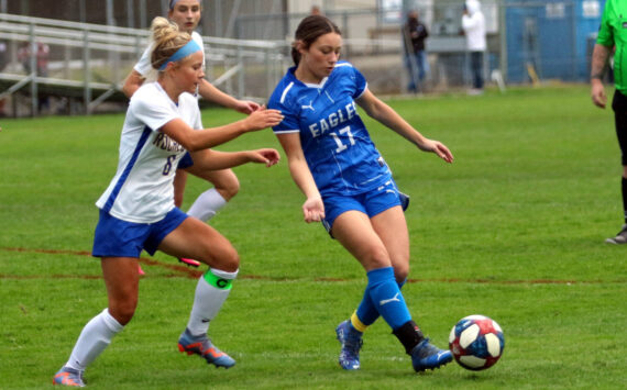 RYAN SPARKS | THE DAILY WORLD Elma midfielder Aubree Simmons (17) passes the ball while defended by Rochester’s Emily Beasley during a 4-0 victory on Thursday at Elma High School.