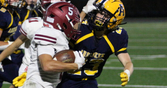 RYAN SPARKS | THE DAILY WORLD Hoquiam running back Kingston Case (5) tries to avoid the tackle of Aberdeen defender Daden Wixson (right) during the Bobcats’ 34-9 win on Friday at Stewart Field in Aberdeen.