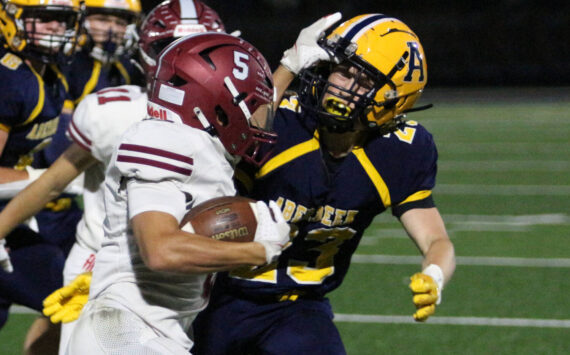 RYAN SPARKS | THE DAILY WORLD Hoquiam running back Kingston Case (5) tries to avoid the tackle of Aberdeen defender Daden Wixson (right) during the Bobcats’ 34-9 win on Friday at Stewart Field in Aberdeen.