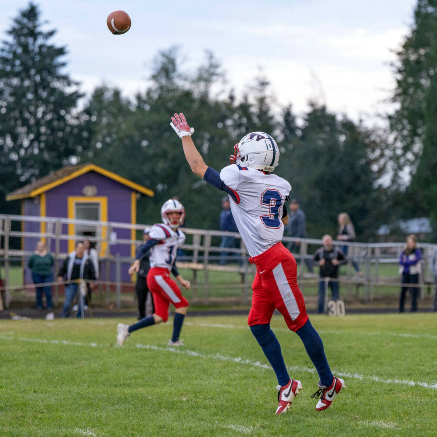 KODY CHRISTEN / THE CHRONICLE 
Pe Ell-Willapa Valley receiver Blaine King makes a catch during a game against Onalaska on Sept. 13. The Titans will face Pacific County rival Raymond-South Bend on Friday in Menlo.