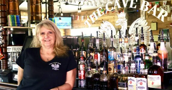 Michael S. Lockett / The Daily World
The Cave Bar’s owner Tracy Hatton poses for a photo in the newly reopened bar in Aberdeen.