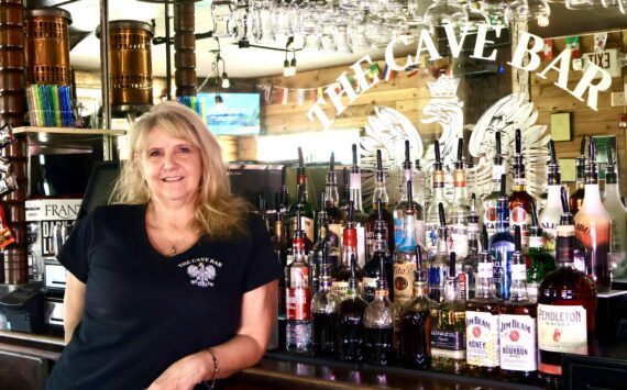 Michael S. Lockett / The Daily World
The Cave Bar’s owner Tracy Hatton poses for a photo in the newly reopened bar in Aberdeen.