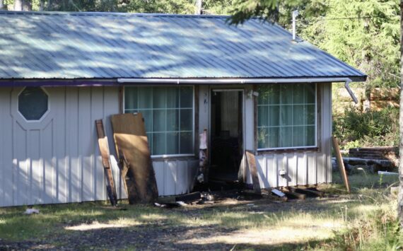 Charring from a small fire Thursday morning is evident on a Westport house. (Michael S. Lockett / The Daily World)