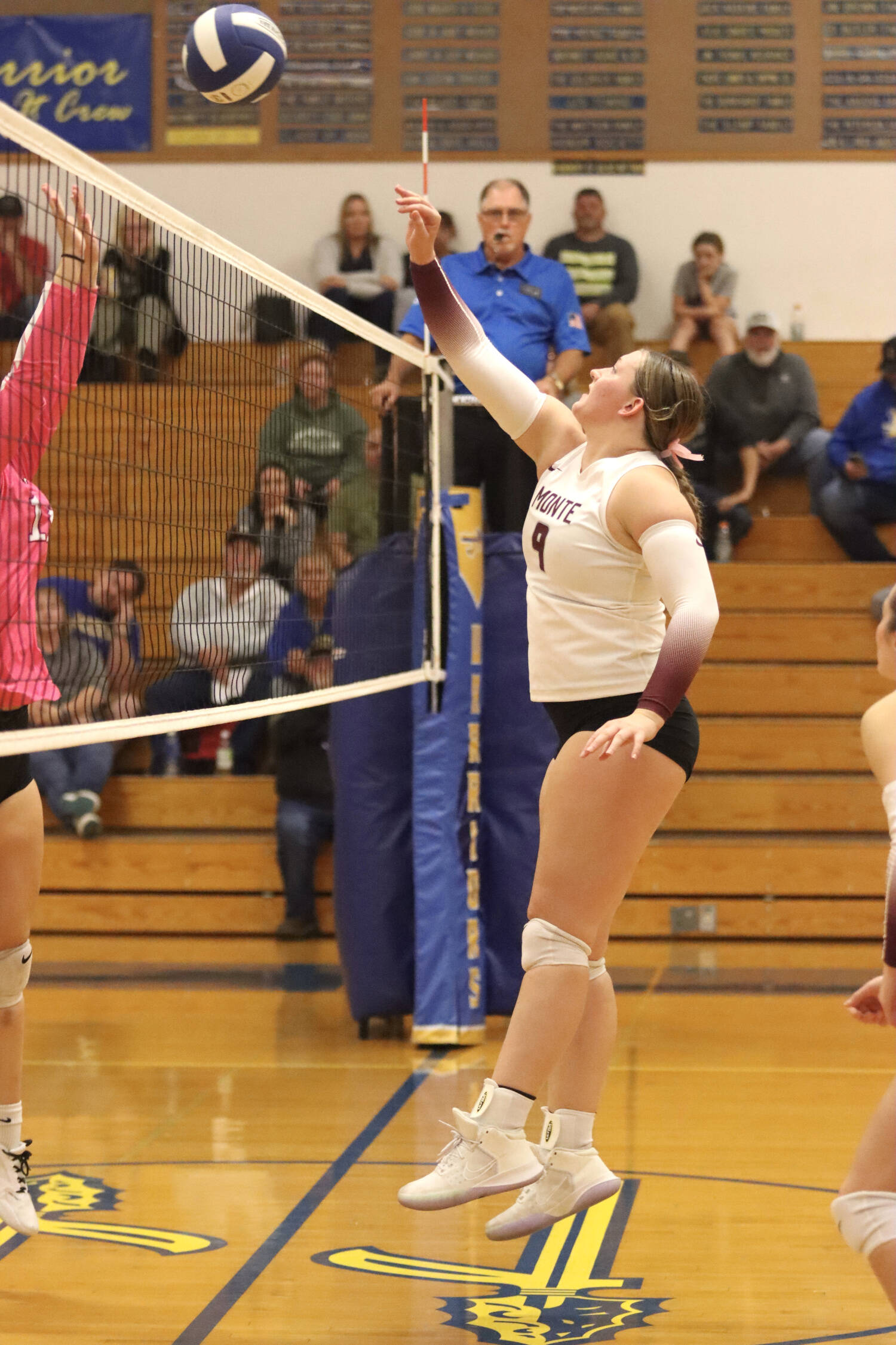 PHOTO BY HAILEY BLANCAS Montesano middle blocker Kylee Wisdom (9) makes a play at the net during a straight-set victory over Rochester on Thursday at Rochester High School.