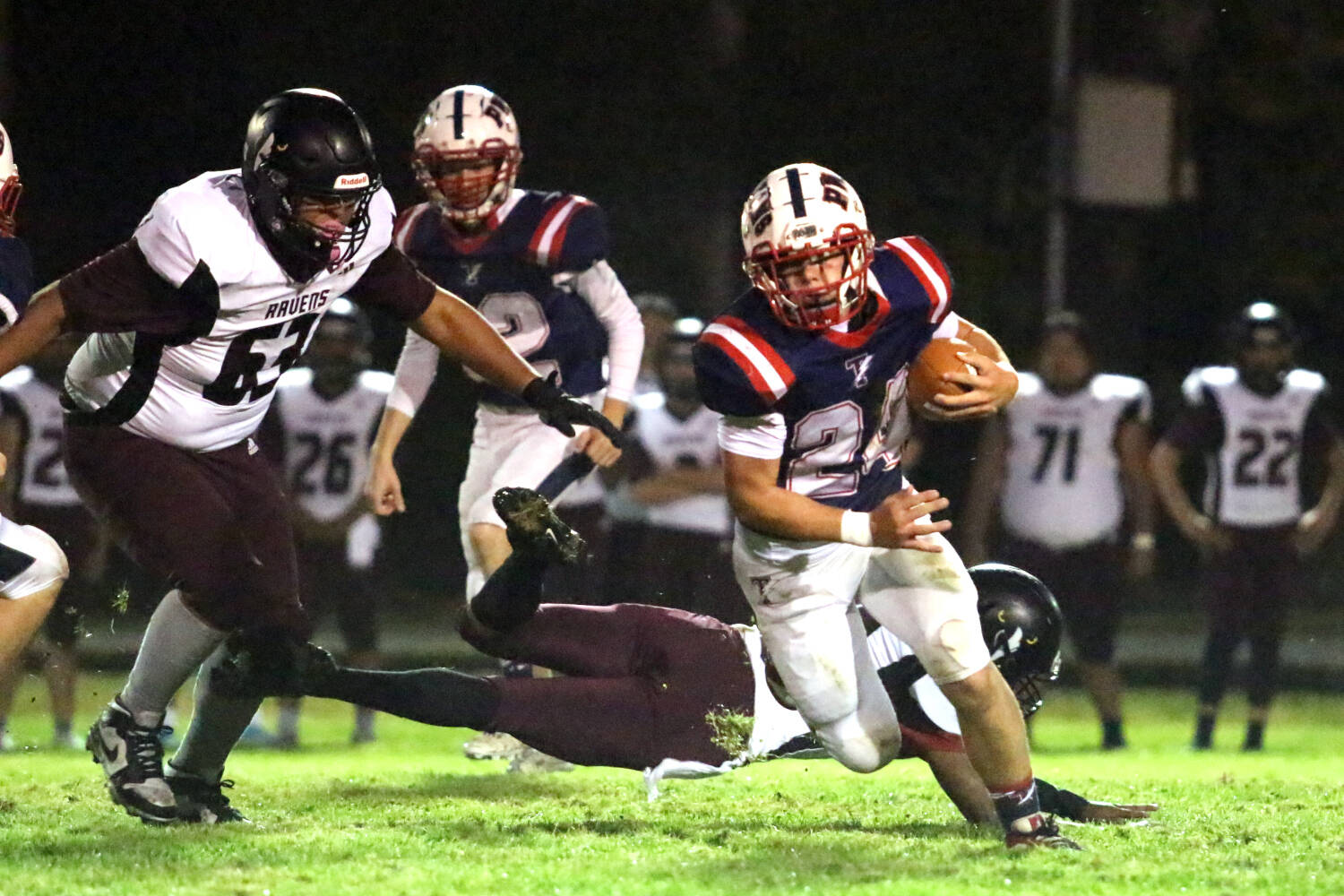 RYAN SPARKS | THE DAILY WORLD Pe Ell-Willapa Valley running back Lucas Lusk (24) runs away from Raymond-South Bend defender Adrian Camacho (63) during the Titans’ 53-14 win on Friday in Menlo.