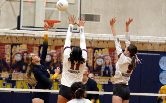 RYAN SPARKS | THE DAILY WORLD Aberdeen’s Morgan McCombs (5) puts up a shot over Hoquiam’s Aaliyah Kennedy (11) and Hayden Brook-Andrew during the Bobcats’ 3-0 win on Monday at Aberdeen High School.