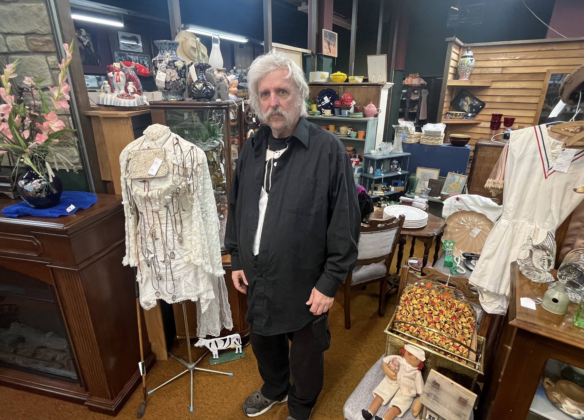 Matthew N. Wells / The Daily World
LeRoy Sisk, owner of Past and Present Mercantile, stands in front of The Painted Pelican booth that sits inside his business. The Painted Pelican, owned and operated by Cindi Molchan, comes from Grayland. One of the elements Sisk likes is how unique each vendor is. “As you start looking at each booth, you’ll see everyone has a neat way of selling stuff,” Sisk said.