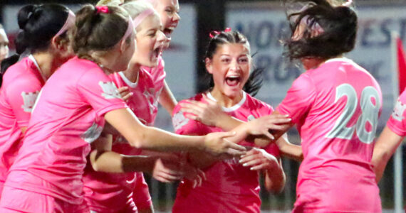 RYAN SPARKS | THE DAILY WORLD Montesano’s Adda Potts (middle) celebrates with teammates after scoring a goal in the first half of a 2-0 win over Elma on Thursday at Montesano High School.