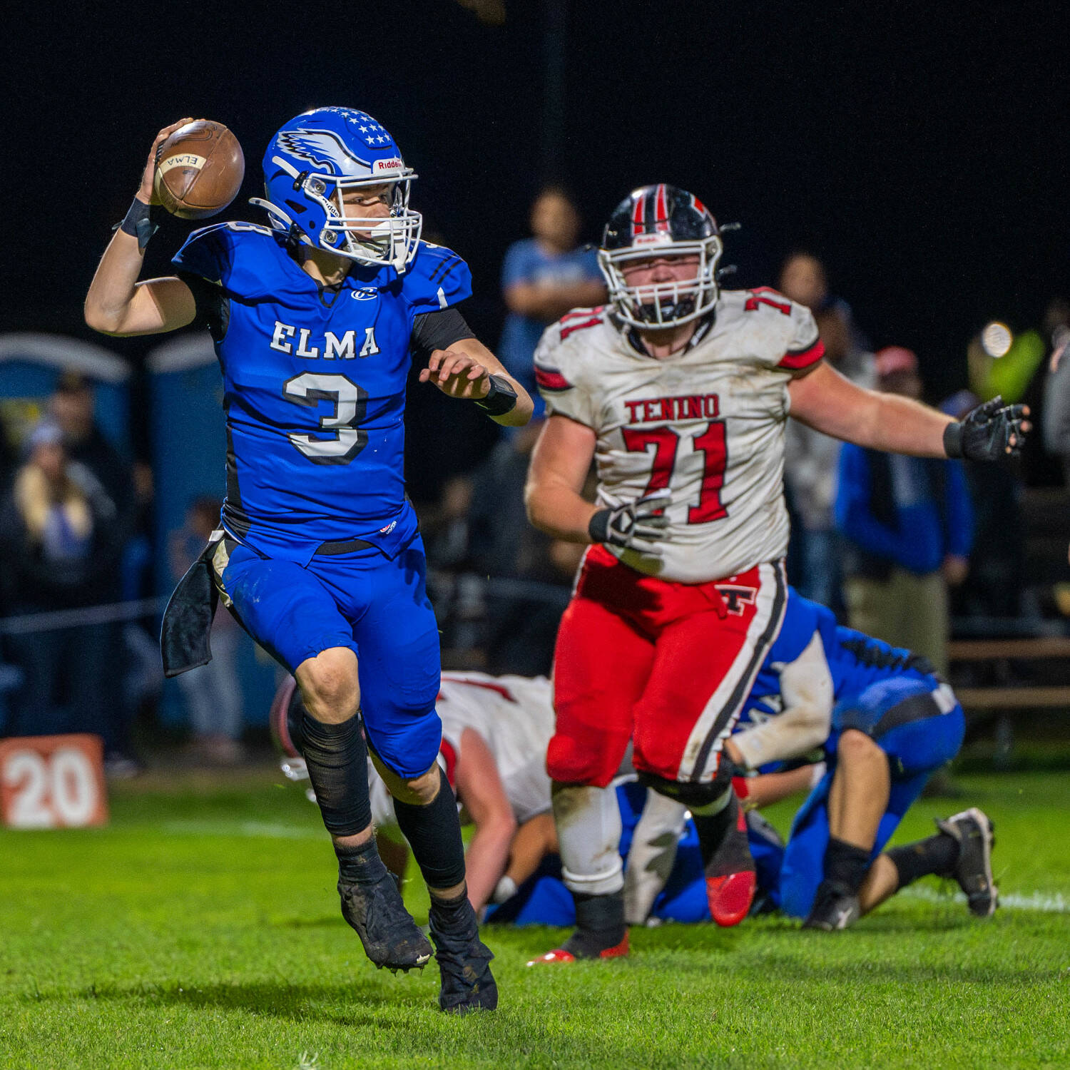 PHOTO BY FOREST WORGUM Elma quarterback Isaac McGaffey (3) looks to throw while pursued by Tenino defensive lineman Rowdie Tafoya in the Eagles’ 27-16 victory on Friday at Davis Field in Elma.