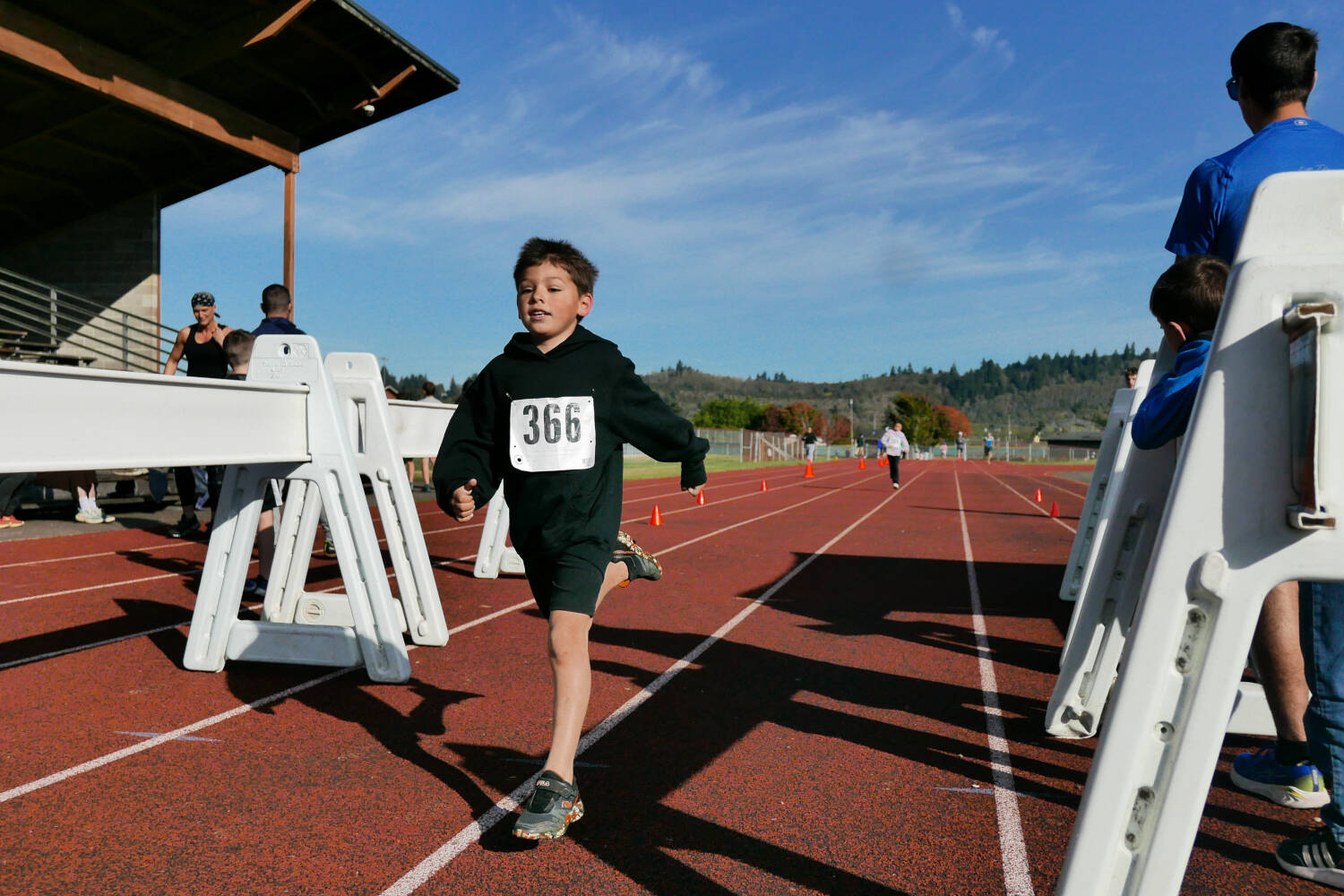 SUBMITTED PHOTO Central Park Elementary School’s Travis McGowan crosses the finish line at the Aberdeen Youth Fun Run on Sunday in Aberdeen.