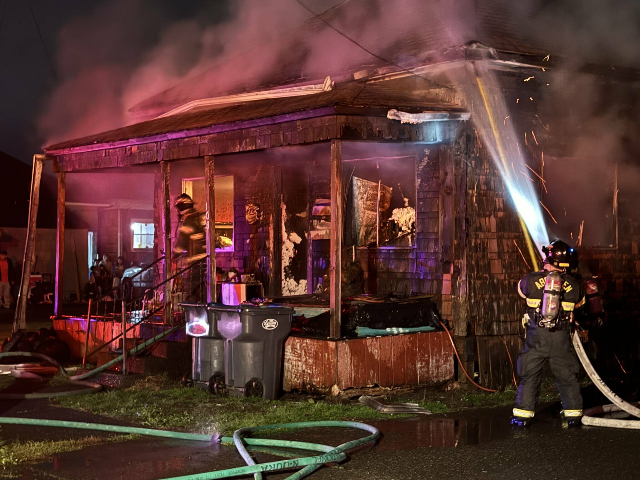 Firefighters battle a structure fire in Aberdeen on Monday night. (Michael S. Lockett / The Daily World)