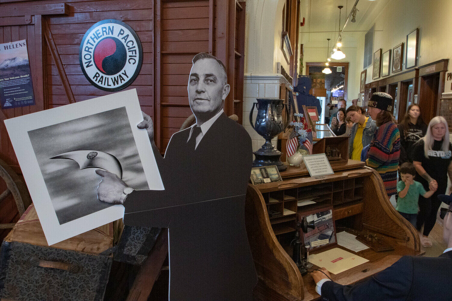 Owen Sexton / The Chronicle
A cardboard cutout of Chehalis pilot Kenneth Arnold greets visitors to the Lewis County Historical Museum on Saturday, Sept. 14, during the Chehalis Flying Saucer Party with an artist rendering of the craft he saw while flying in 1947.