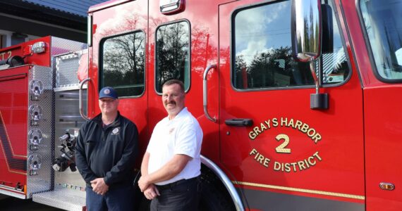 Michael S. Lockett / The Daily World
Grays Harbor Fire District 2 Chief John McNutt, right, and firefighter and district mechanic Casey Hogarty, left, pose in front of the district’s new engine.