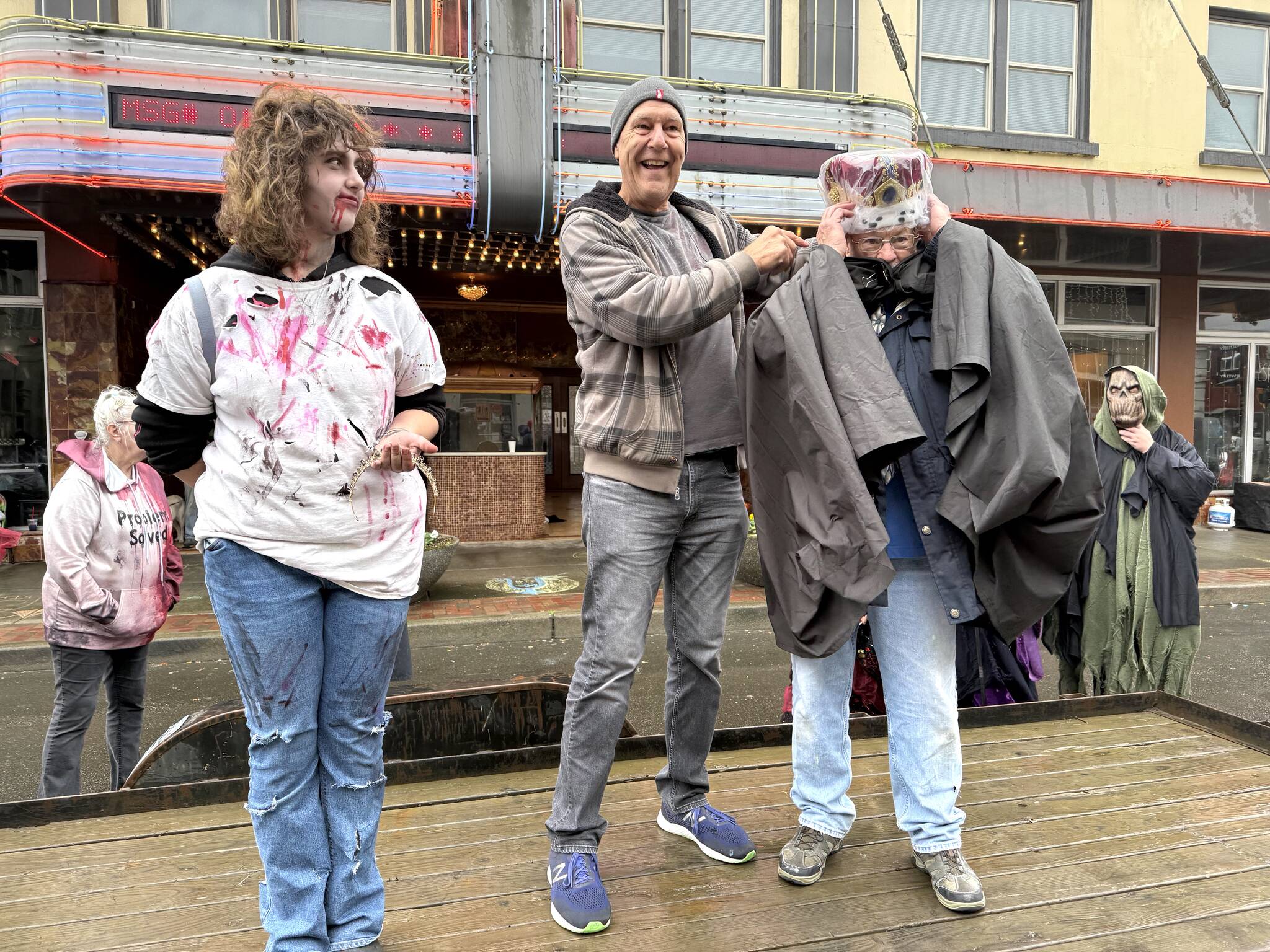 Matthew N. Wells / The Daily World
Aberdeen Mayor Doug Orr, center, crowns Jerry Salstrom Walk of the Undead King while Kylie O’Keefe waits for Orr to crown her queen. Salstrom gave a well-received speech about community and building Aberdeen during the Halloween-themed downtown event.