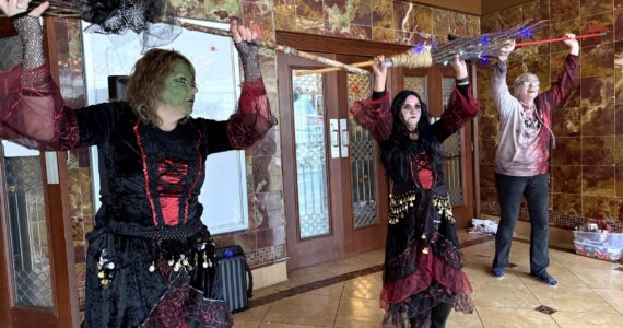 Matthew N. Wells / The Daily World
Three “witches,” Julie Swor, Laurie Butcher and Deb Blecha dance during Walk of the Undead on Saturday in front of the D&R Theatre. Joined by Gwyn Tarrence, not pictured, they provided a fun yet spooky performance that several people applauded.