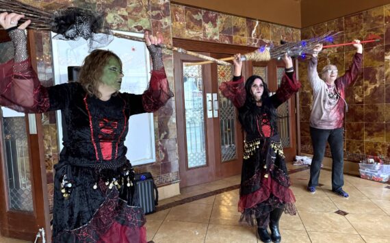 Matthew N. Wells / The Daily World
Three “witches,” Julie Swor, Laurie Butcher and Deb Blecha dance during Walk of the Undead on Saturday in front of the D&R Theatre. Joined by Gwyn Tarrence, not pictured, they provided a fun yet spooky performance that several people applauded.