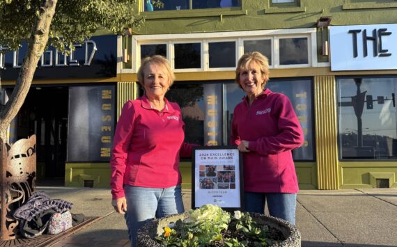 Matthew N. Wells / The Daily World
Bobbi McCracken, left, and Bette Worth stand behind their work as they show off their statewide award they received in Walla Walla on Oct. 17. The 2024 Excellence on Main Award for Organization Excellence, given by the Washington State Main Street Program, is specifically for Aberdeen Bloom Team. But, it also recognizes all the other work the duo, and their team, contributes through Downtown Aberdeen Association.