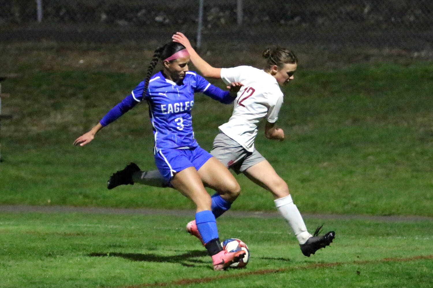 RYAN SPARKS | THE DAILY WORLD Elma senior midfielder Mia Monroe (3) retains possession against Hoquiam midfielder Maggi Quigg during the Eagles’ 4-0 victory on Thursday in Elma.