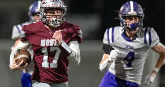 PHOTO BY FOREST WORGUM Montesano running back Terek Gunter (17) runs away from Nooksack Valley’s Cole Bauman during a 34-28 win on Friday at Jack Rottle Field in Montesano.