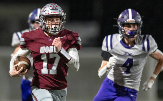 PHOTO BY FOREST WORGUM Montesano running back Terek Gunter (17) runs away from Nooksack Valley’s Cole Bauman during a 34-28 win on Friday at Jack Rottle Field in Montesano.