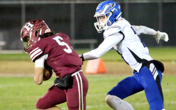 RYAN SPARKS | THE DAILY WORLD Hoquiam’s Kingston Case (5) races away from Elma’s Isaac McGaffey during the Eagles’ 36-14 win on Friday at Olympic Stadium in Hoquiam.