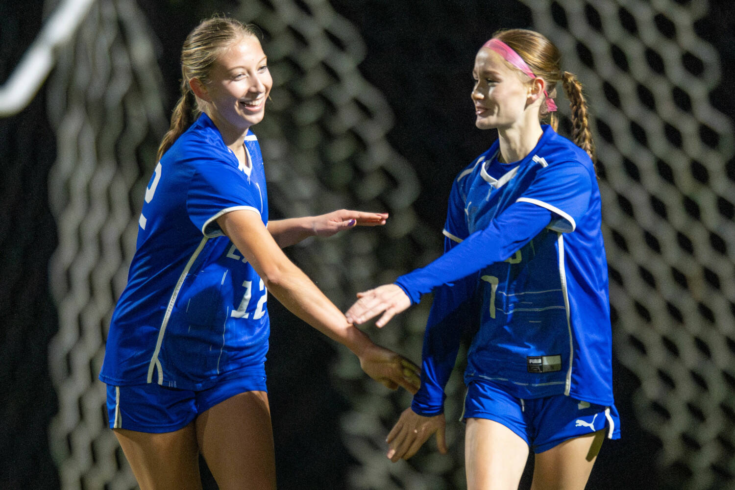 PHOTO BY FOREST WORGUM Elma seniors Beta Valentine (left) and Valerie Echeverria celebrate a goal during the second half of a 2-0 win over Montesano on Tuesday in Elma.