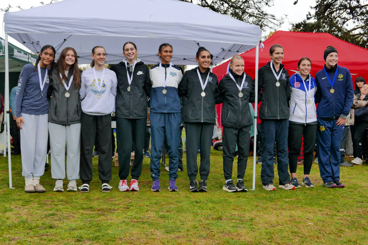 SUBMITTED PHOTO Aberdeen’s Ailyn Haggard (far right) stands with top 10 placers after winning the 2A District 4 Championship on Thursday at the Lewis River Golf Course in Woodland.