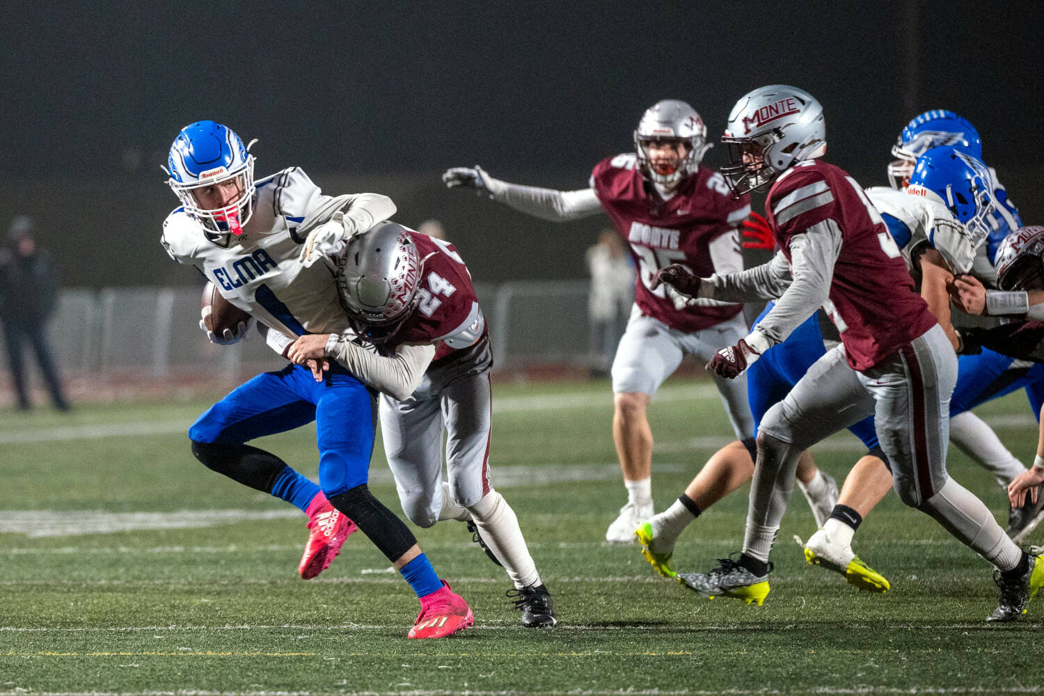 PHOTO BY FOREST WORGUM Elma receiver Ethan Camus (1) is tackled by Montesano’s Kole Kjesbu (24) and Christian Morris (right) during the Bulldogs’ 45-0 win on Friday at Montesano High School.