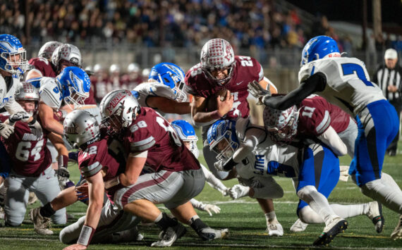 PHOTO BY FOREST WORGUM Montesano’s Marcus Hale (23) dives across the end zone for a touchdown during a 45-0 win over Elma on Friday at Jack Rottle Field in Montesano.