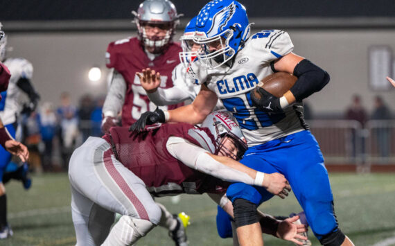 PHOTO BY FOREST WORGUM Montesano linebacker Felix Romero (left) tackles Elma running back Bo Muller during the Bulldogs’ 45-0 win on Friday in Montesano.