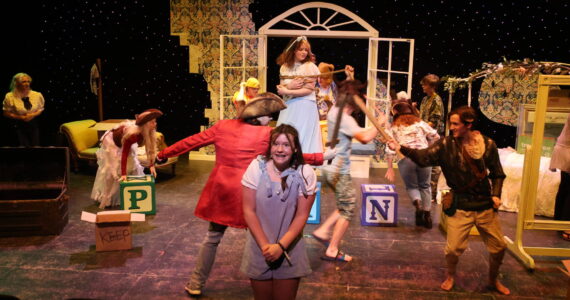 Rick Moyer photos
Adisyn Jones (front center) plays Krista in the Plank Island Theatre Company and Grays Harbor College’s production of Lost Girl.