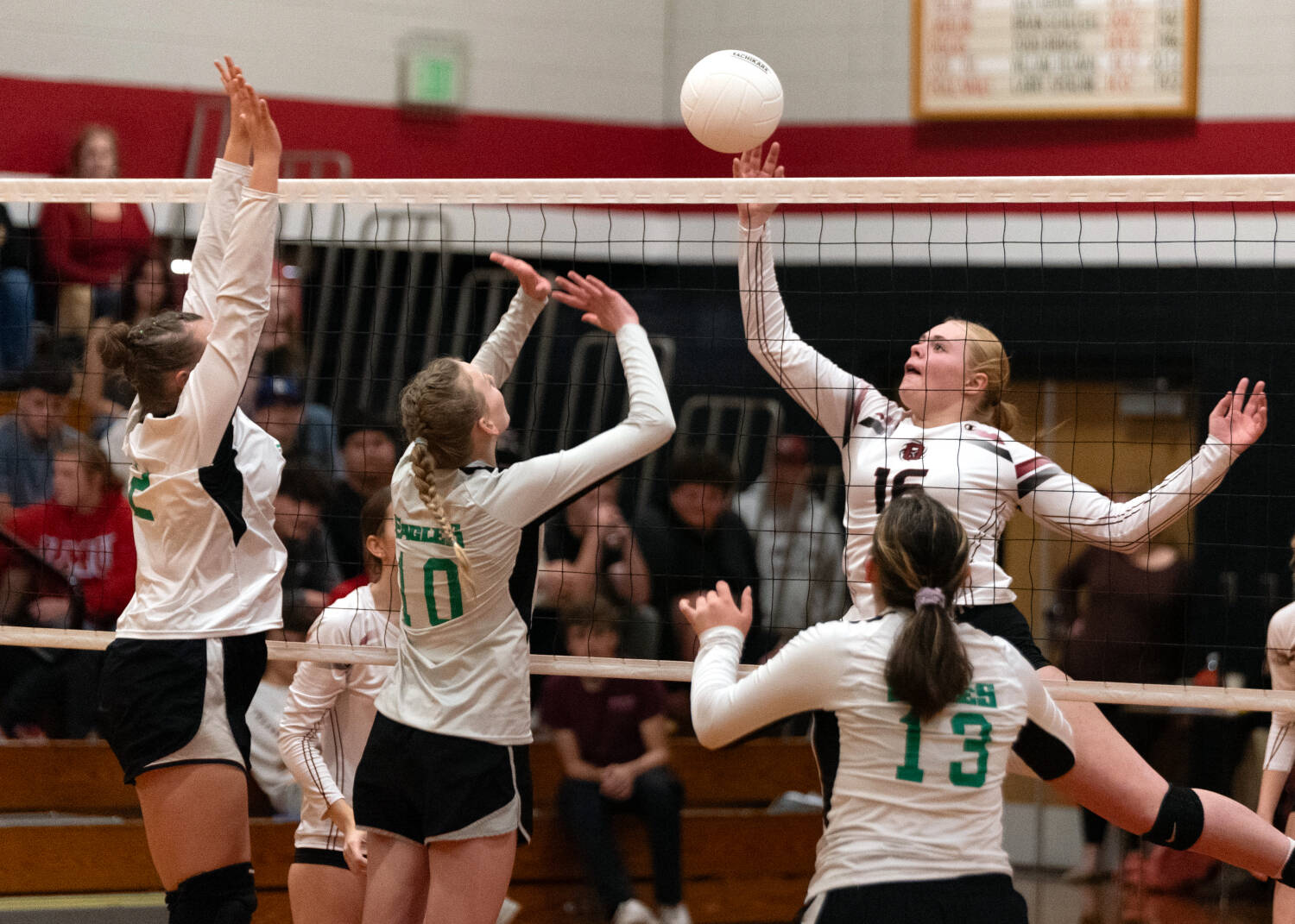 PHOTO BY VAN ADAM DAVIS Ocosta middle hitter Anna Davis (16) sends the ball over the net during a 3-0 win over Firm Foundation in the first round of the 1B District 4 Tournament on Monday in Westport.