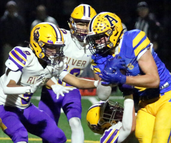 <p>RYAN SPARKS | THE DAILY WORLD Aberdeen running back Micah Schroeder (right) carries the ball against Columbia River defensive back Aedan Pena during the Bobcats’ 7-6 loss in a 2A State play-in matchup on Tuesday at Stewart Field in Aberdeen.</p>