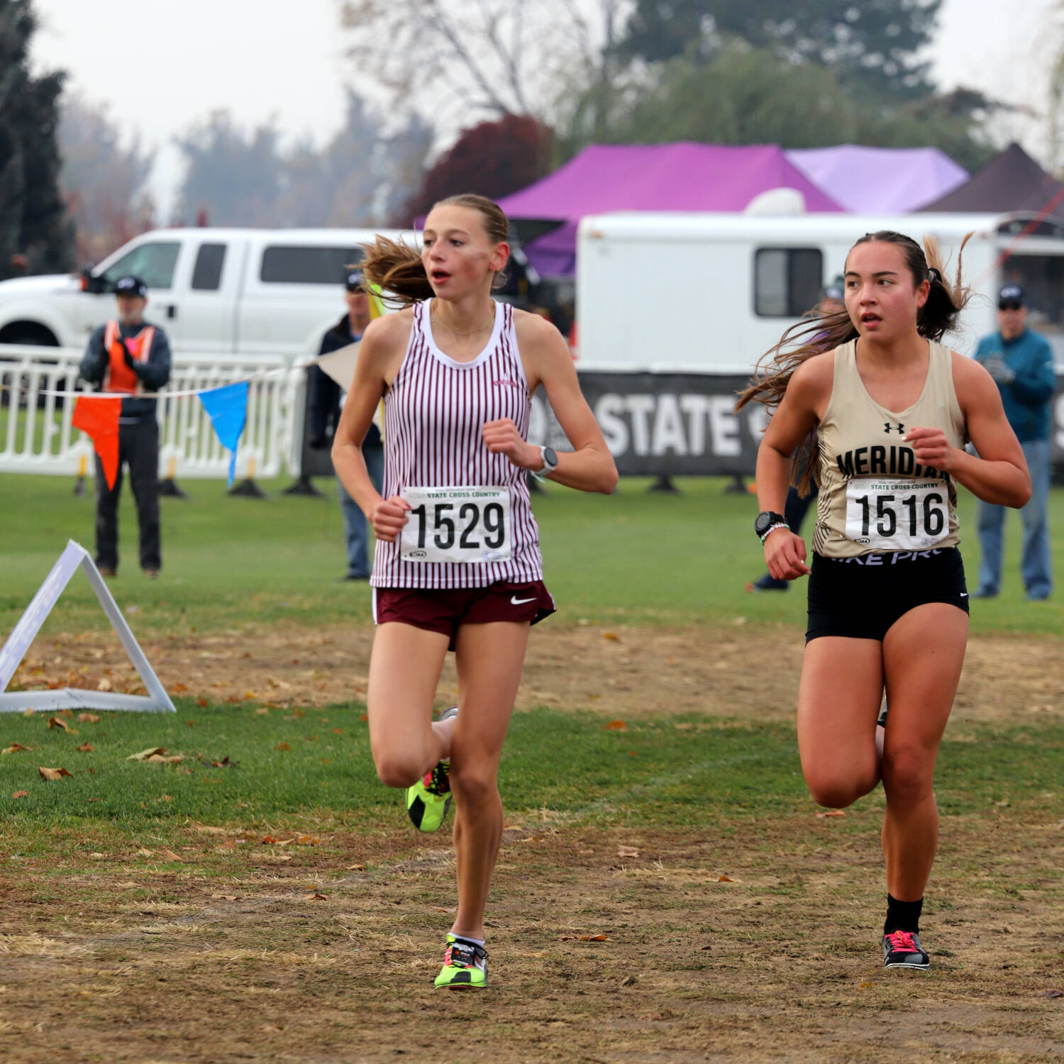 PHOTO BY DENNIS NELSON Montesano sophomore Haley Schweppe (left) leads Meridian’s Logan Ignacio during the WIAA 1A State Girls Cross Country Championship on Saturday at the Sun Willows Golf Course in Pasco.