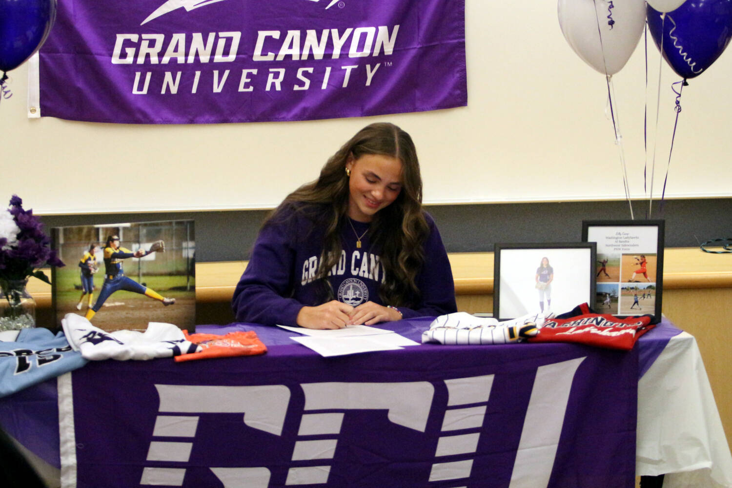 RYAN SPARKS | THE DAILY WORLD Aberdeen senior softball pitcher Lilly Camp made it official by signing a National Letter of Intent to play for Grand Canyon University after graduation. Family, friends, coaches and teammates attended a signing ceremony for Camp on Tuesday at Aberdeen High School.