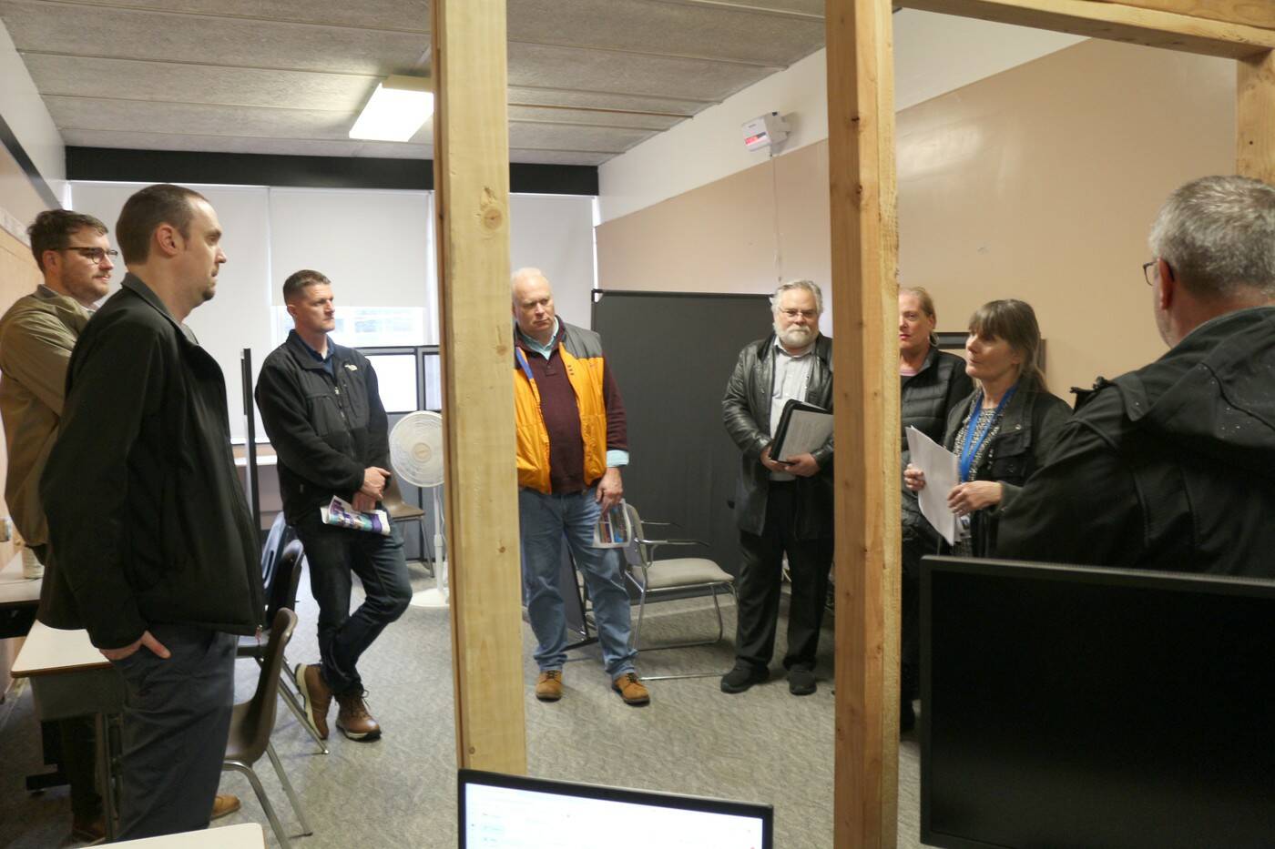 Principal Lisa Griebel shows guests to the Harbor Learning Center an area that is being repurposed for GED testing.